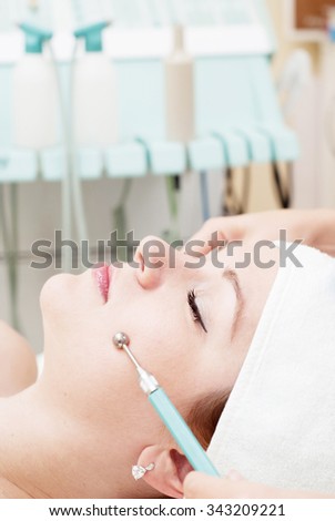 Hardware rejuvenation and lifting facial skin for a woman in a beauty salon