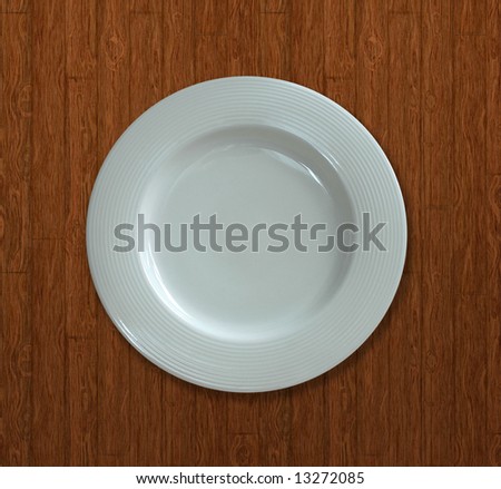 Top view of a white dish on a textured background