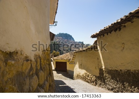View of a street in cusco. The buildings are made of adobe with a stone foundation. Cusco, Peru, South America.
