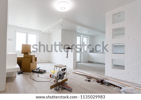 Interior of apartment with materials during on the renovation and construction ( remodel wall from gypsum plasterboard or drywall)