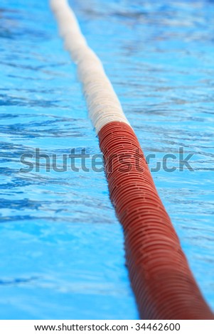 dividing track of red and white colors in a pool water