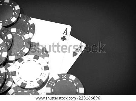 Casino table with a pair of aces and chips
