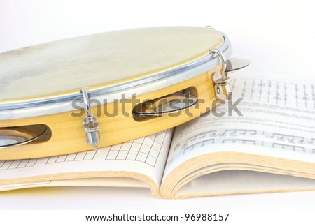 Latin tambourine and music score
