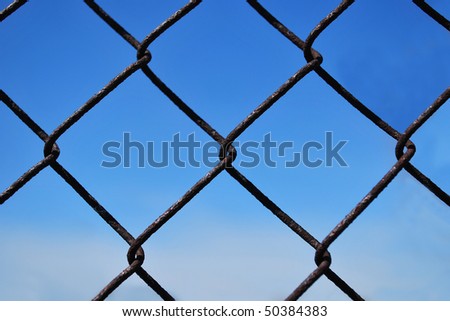 Rusty iron fence close up.