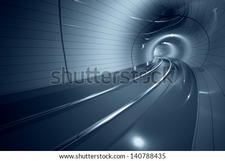 Inside the modern subway corridor. Curved line of the train tracks. May represent travel, speed, urban communication or futuristic technology.