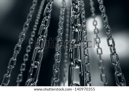 Reflective chrome chain on a dark background. Can be associated with strength, connection, industry or imprisoning.