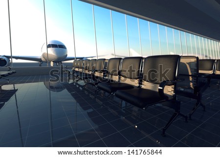 Modern airport terminal with black leather seats on a sunny morning. A huge viewing glass facade with a passenger aircraft behind it.