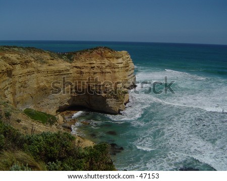 A view near the 12 apostles at the Great Ocean road. The great Ocean waters constantly hitting upon this battered hill side