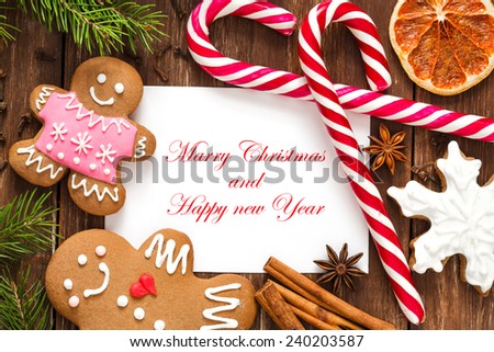 Christmas greeting card on the wooden background