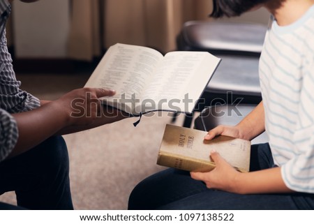 Christians and Bible study concept.Meeting the people of Christ religion, Group of christians studying the word of god in church and praying together