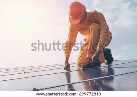 Electrical engineers are checking and repairing. fitting a photovoltaic plant in solar power station alternative energy from nature, Clean Energy,Renewable energy and solar power concept