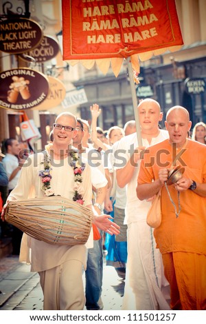 PRAGUE, CZECH REPUBLIC - AUG. 17: Unidentified members of Hare Krishna chanting and dancing  during the Vaishnava religious festival on August 17, 2012 on the streets of Prague in Czech Republic