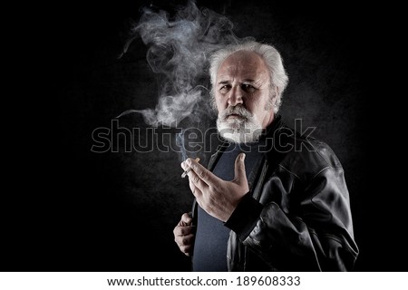 Tough man with white beard smoking