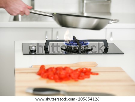 Preparing  vegetables in wok pan