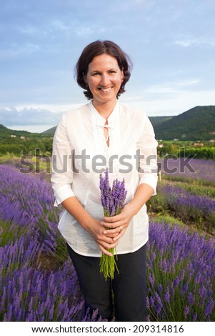 Woman holding lavander flowers bouquet