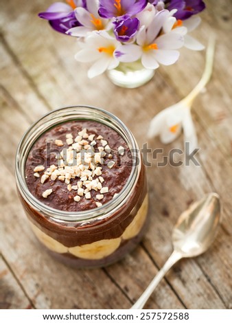 delicious paleo and vegan cocoa porridge with banana and almonds