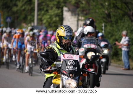 SISTIANA, ITALY – MAY 10 : Tour marshals lead cyclists from main group at the second stage (Jesolo – Trieste) in the Tour of Italy May 2009 in Sistiana, Italy.