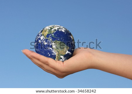 Earth in female hand, photo of the Earth from NASA