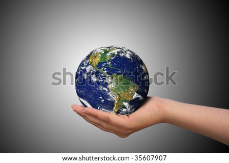 Earth in female hand, photo of the Earth from NASA