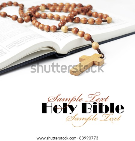 Open Bible with rosary beads