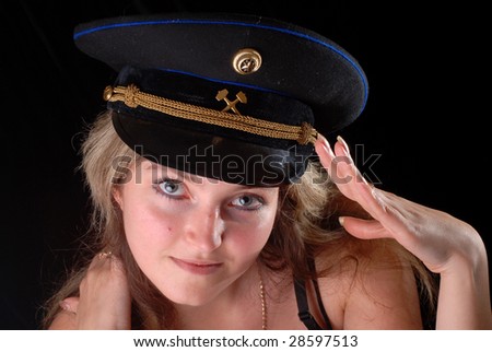 beatiful girl wearing soviet officer miner cap saluting
