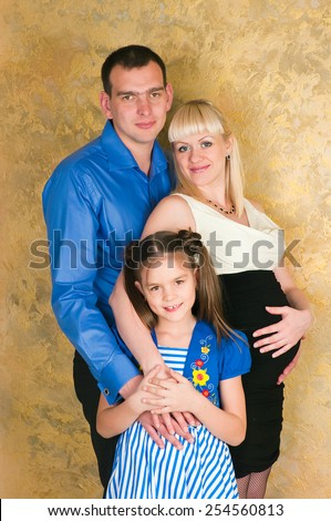 Elegant family with one child in anticipation of the birth of the second child