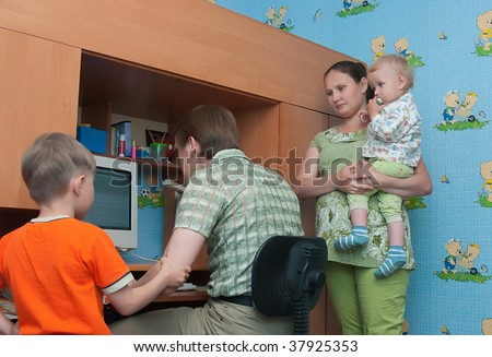 The conflict in a family: the husband plays the computer and does not pay attention to a family