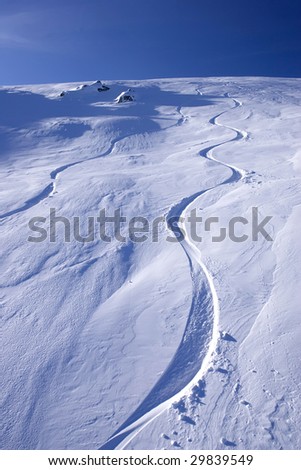 mountain snow snowboarding summit top tracks in the snow speed recreation blue sky vertical skiing ski resort