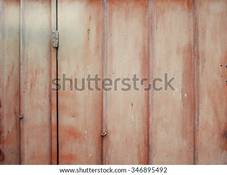 Faded red peeled metal texture background.