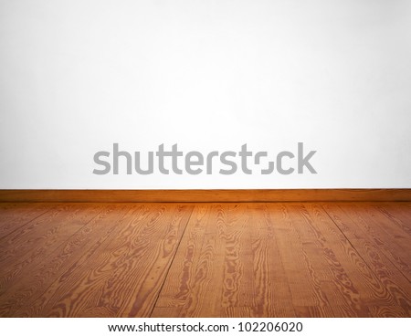 Empty White Wall And Wooden Floor