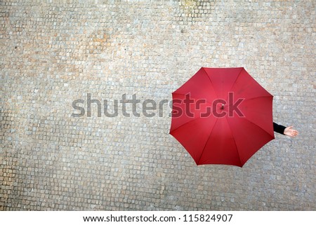 Businesswoman Hidden Under Umbrella And Checking If It\'S Raining