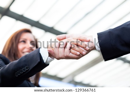 Businesspeople shaking hands at the office