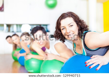 Group of people in a class of Pilates at the gym
