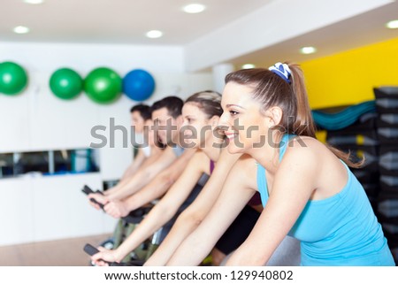 Group of people in the gym doing cardio training