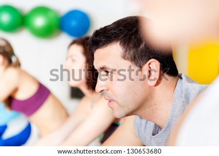 Group of people in the gym doing cardio training