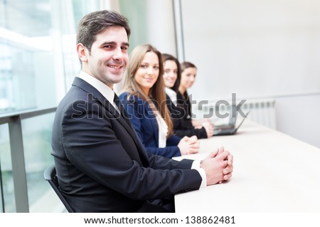 Group of business people smiling at the office lined up