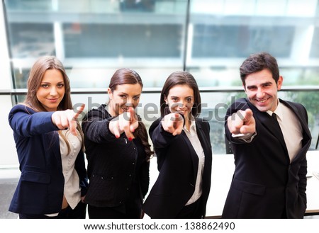 Businesspeople pointing at you and smiling