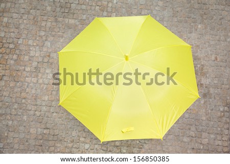 Yellow umbrella outdoors, season concept