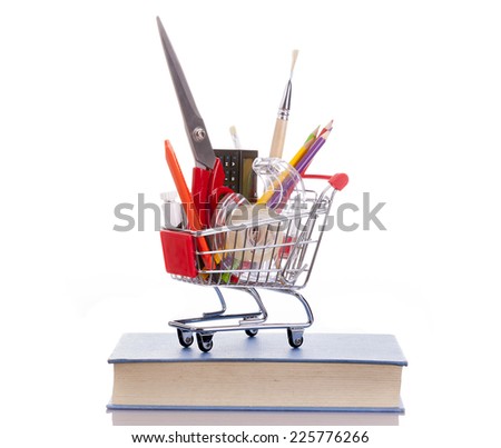 Shopping cart full of school material, isolated on white background