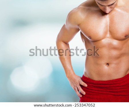 Fitness man in towel at the gym