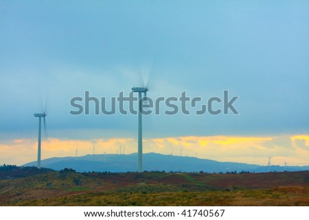 windmills in the top of a montain, alternative energy source