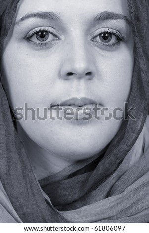 Close-up portrait a woman with a veil, arabic style