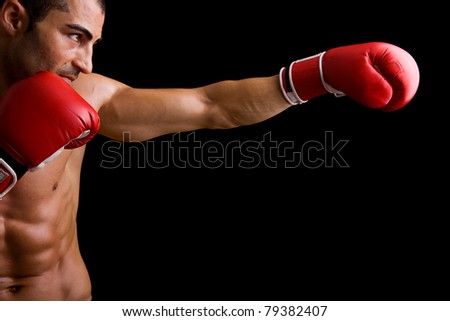 Young Boxer fighter over over black background Young Boxer fighter over over black background