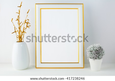 Gold frame mockup with small cactus. Frame mockup. White frame mockup.