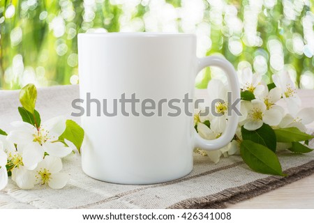 Mug mockup with apple blossom. Mug mockup. Coffee cup template. Coffee mug template. Mug template. Mug design template. Mug design. Mug printing design. White mug mockup. Cup mockup. Blank mug.