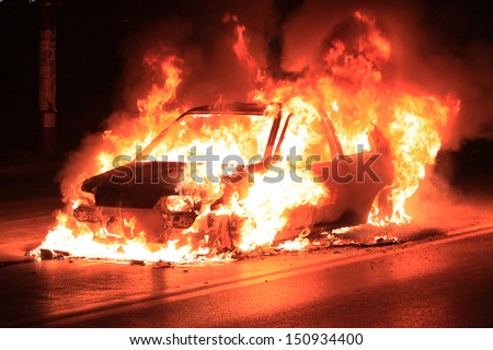 Burning car on the road