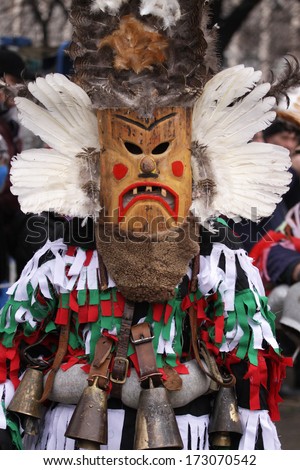 Pernik, Bulgaria - Jan 25, 2014: Traditional Kukeri Costume Are Seen At The The International Festival Of The Masquerade Games Surva In Pernik, Bulgaria. Photo Taken On: January 25th, 2014