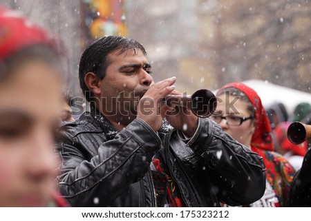 PERNIK, BULGARIA - JAN 25, 2014: Man who plays on pipe at the International Festival of the Masquerade Games \