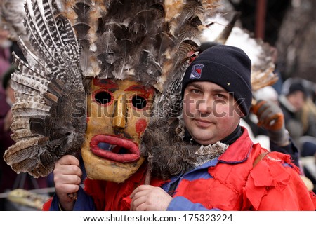 PERNIK, BULGARIA - JAN 25, 2014: Man in traditional masquerade costume is seen at the the International Festival of the Masquerade Games \