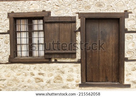Old beautiful door and window in house in Bansko, Bulgaria